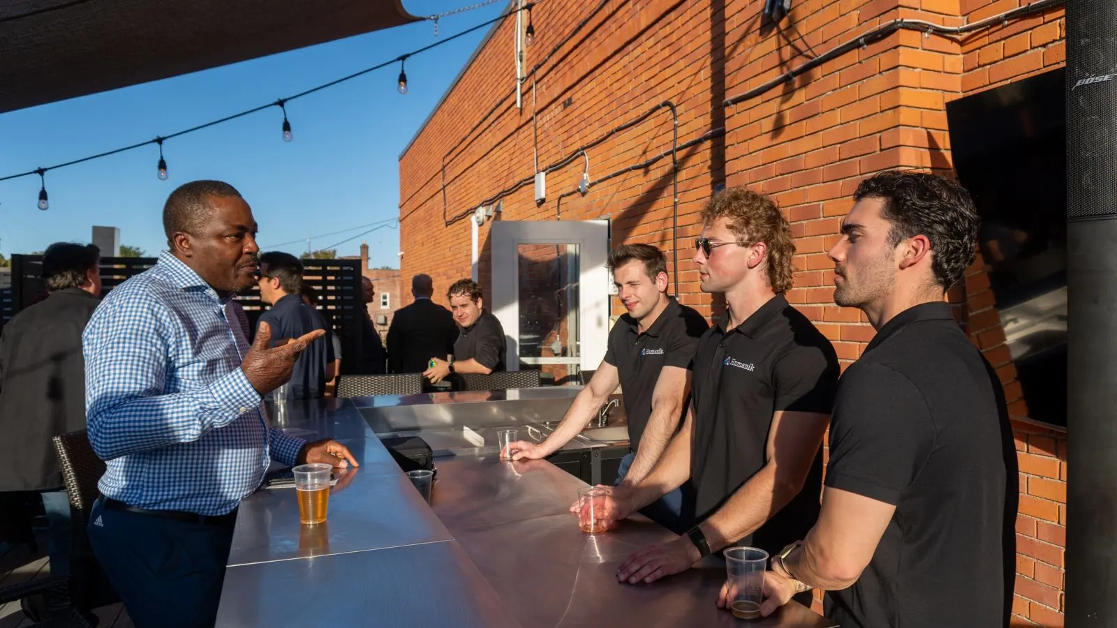 Guest talking with hosts at a brand event