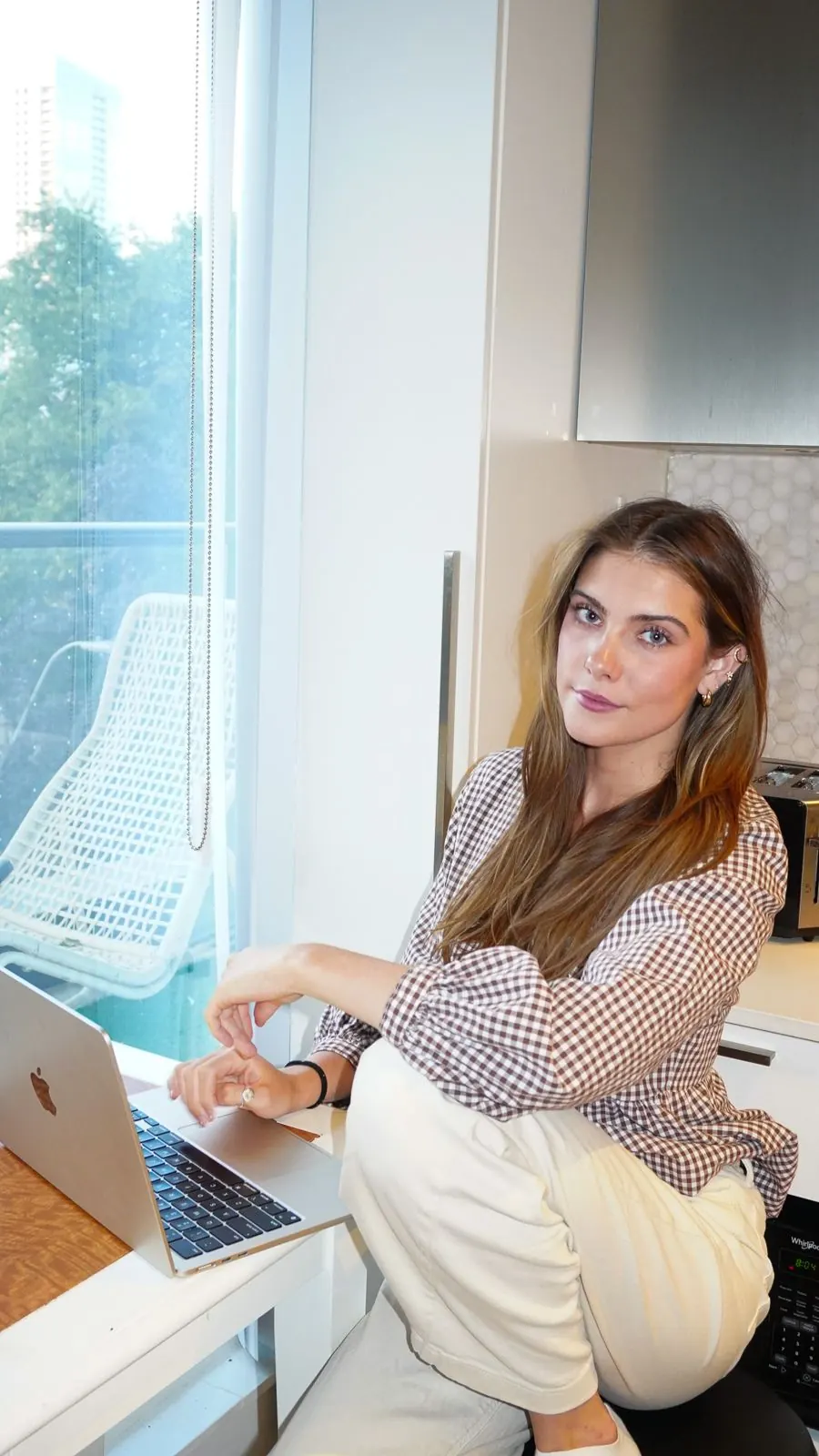 Katya Sokolyk, full-stack marketer, at her laptop